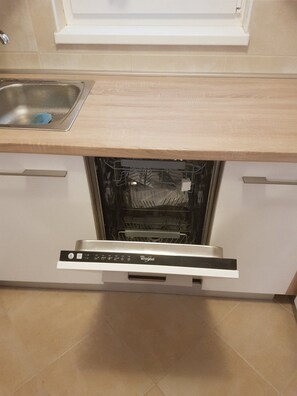 Apartment (Superior Two Bedroom Apartment with T) | Private kitchen | Fridge, dining tables - Apartments Božić (Novi Vinodolski)