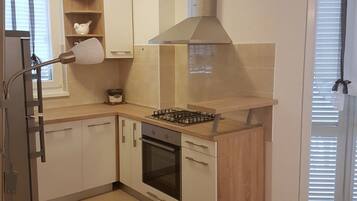 Apartment (Superior Two Bedroom Apartment with T) | Private kitchen | Fridge, dining tables