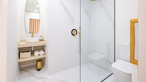 Shower, hair dryer, towels, shampoo
