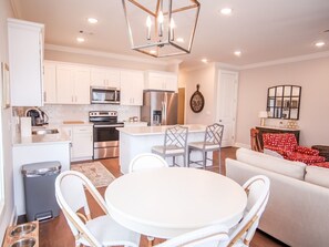 Cozy living space with a round dining table and comfortable seating for meals.