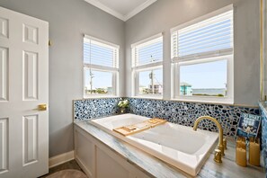 Shower, jetted tub, hair dryer, towels
