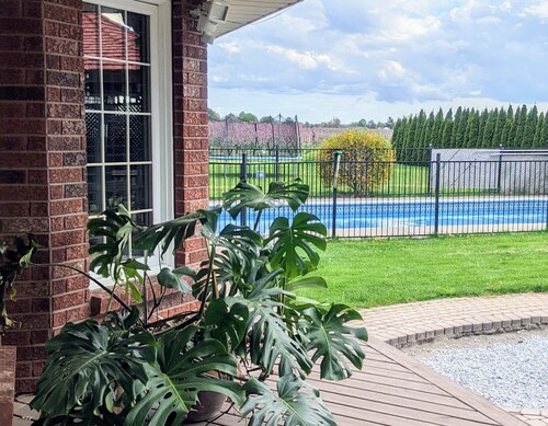 A poolside guest suite nested in a beautiful orchard along winery route