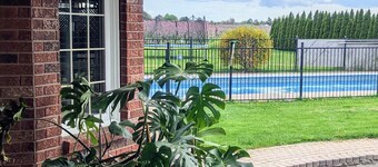 A poolside guest suite nested in a beautiful orchard along winery route