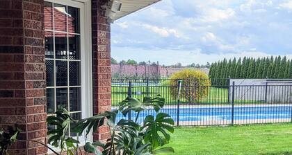 A poolside guest suite nested in a beautiful orchard along winery route