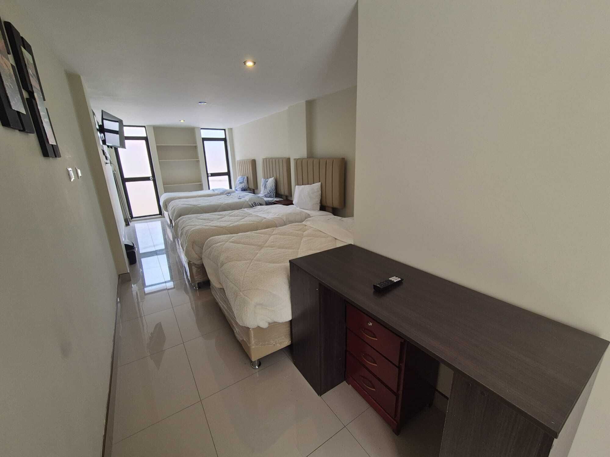 Neljän hengen classic-huone | Ylelliset vuodevaatteet, untuvapeitot, pillowtop-patjalliset sängyt