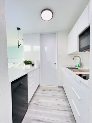 Fridge, microwave, stovetop, coffee/tea maker