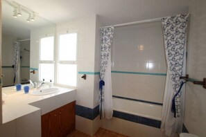 Bathtub, hair dryer, towels