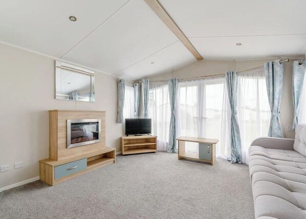 Living area - 12ft-wide very comfortable and spacious caravan with one double and two twin. (Roman Bank, Skegness)