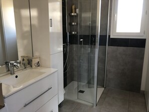 Shower, hair dryer, towels, soap