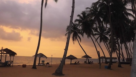 Private beach, white sand, sun loungers, beach towels