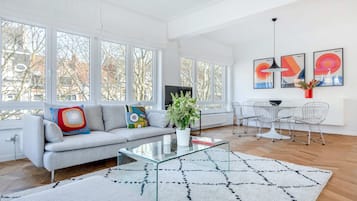 Premium Apartment | Living area | 70-inch TV with cable channels, fireplace