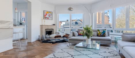 Premium Apartment | Living area | 70-inch TV with cable channels, fireplace