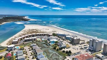 On the beach, sun-loungers
