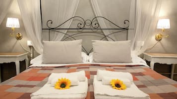 Junior Quadruple Room | Down comforters, in-room safe, desk, blackout drapes