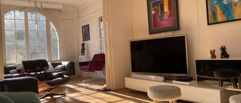 TV, fireplace, books, printers