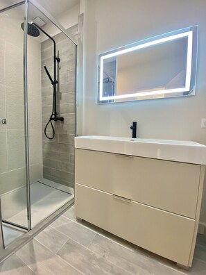 Shower, hair dryer, towels, soap