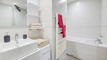 Shower, hair dryer, towels, toilet paper