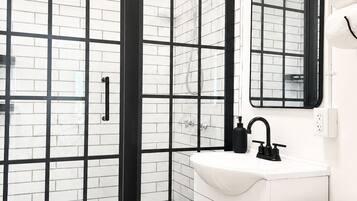 Shower, hair dryer, towels, toilet paper