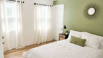1 bedroom, desk, iron/ironing board, travel crib