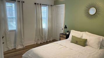 1 bedroom, desk, iron/ironing board, travel crib