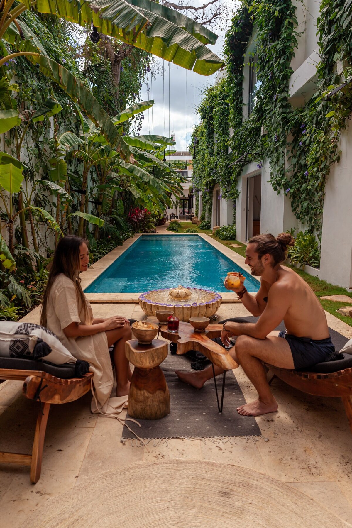 couple at Olbil Hotel Boutique pool area