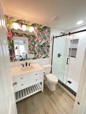 Shower, hair dryer, towels, soap