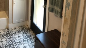 A small bathroom with a shower, a towel rack, and a cabinet. - Downtown Secluded & Peaceful Armory Park 10 min walk to Club Congress (Tucson)
