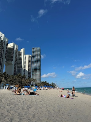 On the beach, sun-loungers, beach towels