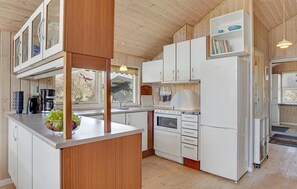 Fridge, stovetop, dishwasher, coffee/tea maker