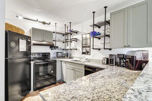 Coffee/tea maker, fridge, microwave, oven