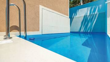 Seasonal outdoor pool, pool umbrellas, pool loungers