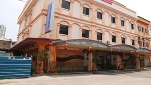 A hotel with a classic architectural style, featuring a prominent entrance with a covered walkway and decorative lanterns. - OYO 90269 Hotel Indorasa 2 (Batam)