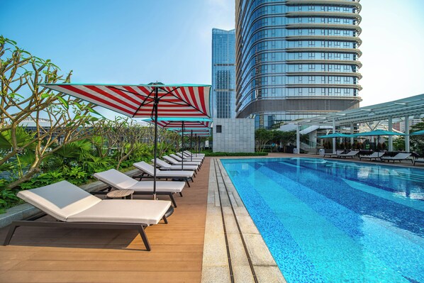 Seasonal outdoor pool, open 9:00 AM to 7:00 PM, pool umbrellas