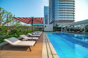 Seasonal outdoor pool, open 9:00 AM to 7:00 PM, pool umbrellas