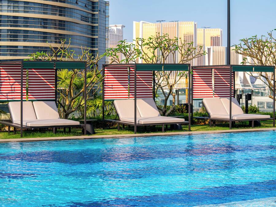 Seasonal outdoor pool, open 9:00 AM to 7:00 PM, pool umbrellas