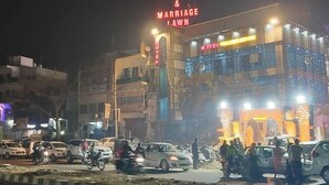 A hotel with a neon sign reading "HOTEL & MARRIAGE LAWN". - Hotel Celebration (Deoria)
