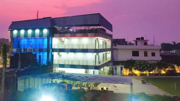 A multi-story building with a flat roof and a balcony. - Hotel Celebration (Deoria)