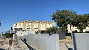 A row of residential buildings with a clear sky. - Modern Studio with Terrace, AC, and Parking (Balaruc-les-Bains)