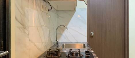 Deluxe Apartment, 1 Bedroom | Private kitchen | Full-size fridge, stovetop