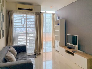 Apartamento Deluxe, 2 habitaciones | Zona de estar