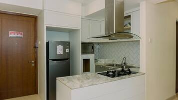Deluxe Apartment, 2 Bedrooms | Private kitchen | Full-size fridge, stovetop