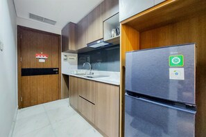Appartement Deluxe, 1 chambre | Cuisine privée | Réfrigérateur grande capacité avec congélateur, surface de cuisson
