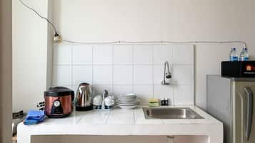 Apartamento Deluxe | Cocina privada | Frigorífico grande y placa de cocina