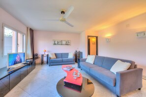 Standard Apartment, Multiple Bedrooms, Refrigerator & Microwave (Residenza Borgo Rustico) | Living area | 21-inch flat-screen TV with satellite channels, TV, stereo