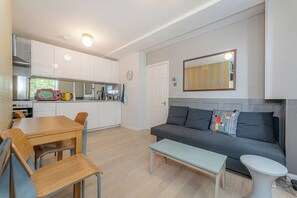 Apartment (2 Bedrooms) | Living area | 32-inch TV with cable channels