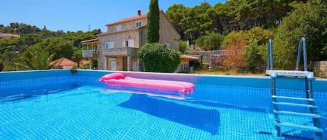 Seasonal outdoor pool, pool umbrellas, pool loungers