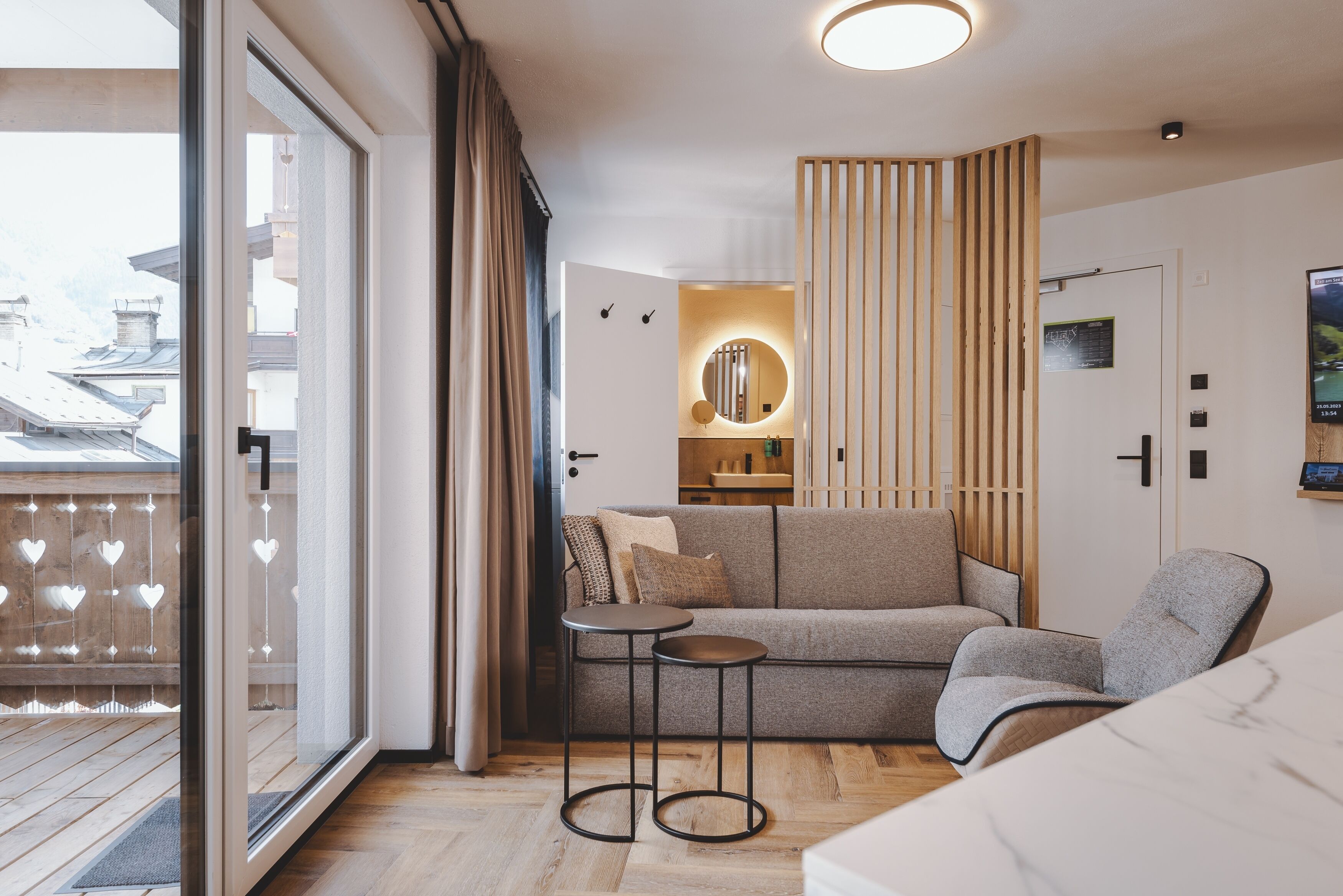 A modern interior with a sofa, a small table, and a chair.