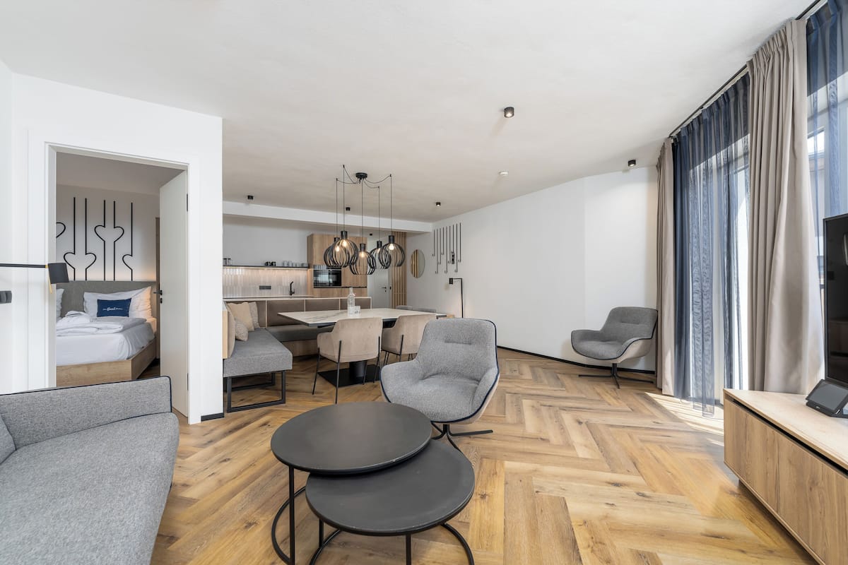 Deluxe Suite, 2 Bedrooms, Sauna | Living area | 30-inch flat-screen TV with cable channels, TV