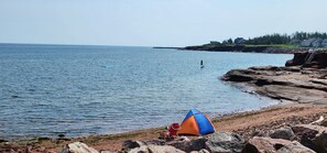 On the beach, sun-loungers, beach towels