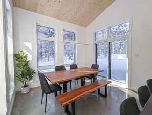 Meetings take place around a large table in this well-appointed room with a view of the surrounding landscape.